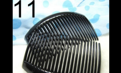 11 Black plastics comb (around 8.5cm x 5cm)